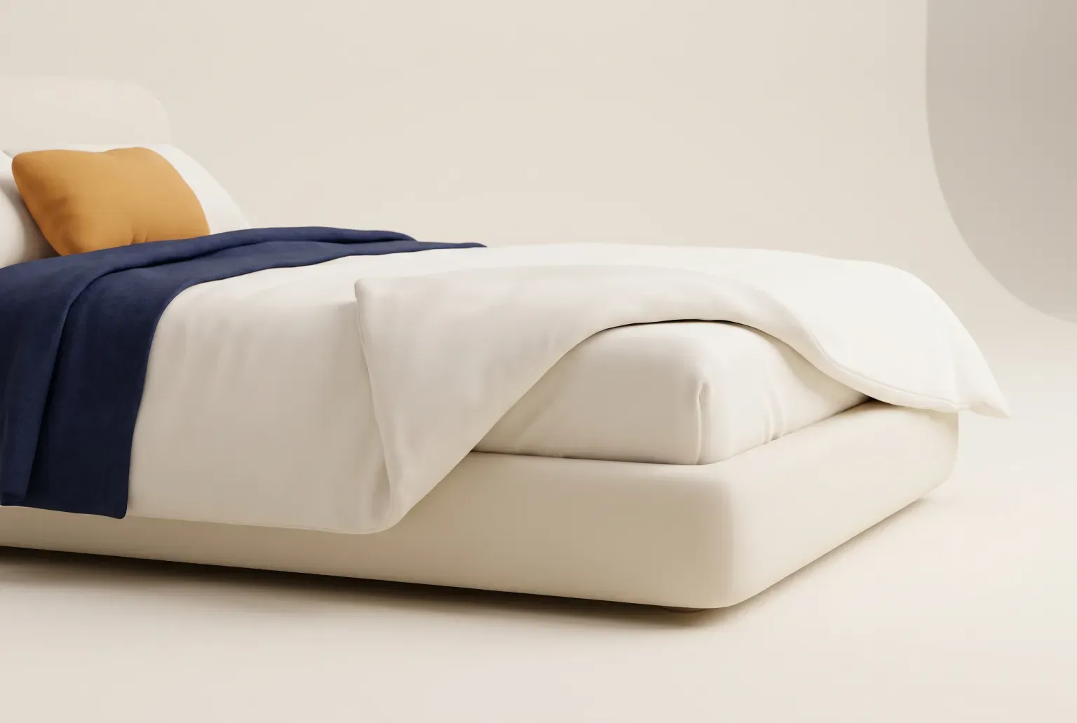 Illustration: a low cream platform bed made up with plain white sheets and a navy blanket, with one corner of the top sheet folded back to show the fitted sheet, drawn as a soft 3D render. Not a real product.