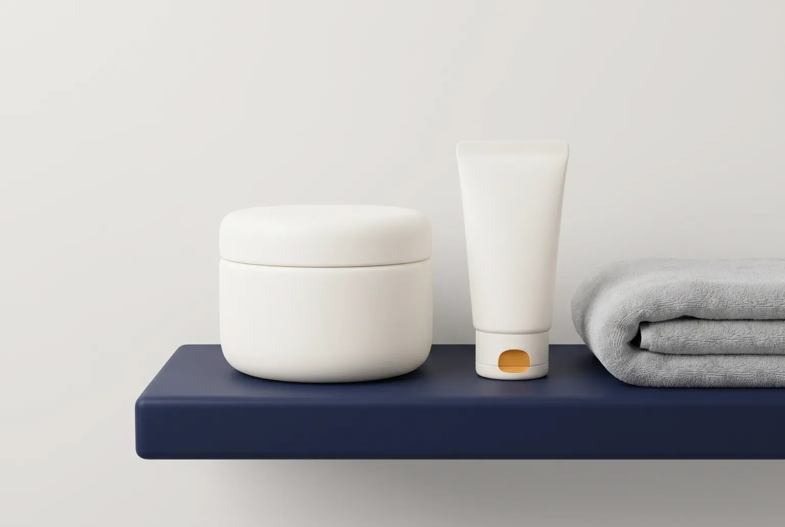 Illustration: a plain cream cream jar and a small cream tube on a navy bathroom shelf beside a folded grey towel, drawn as a soft 3D render. Not a real product.