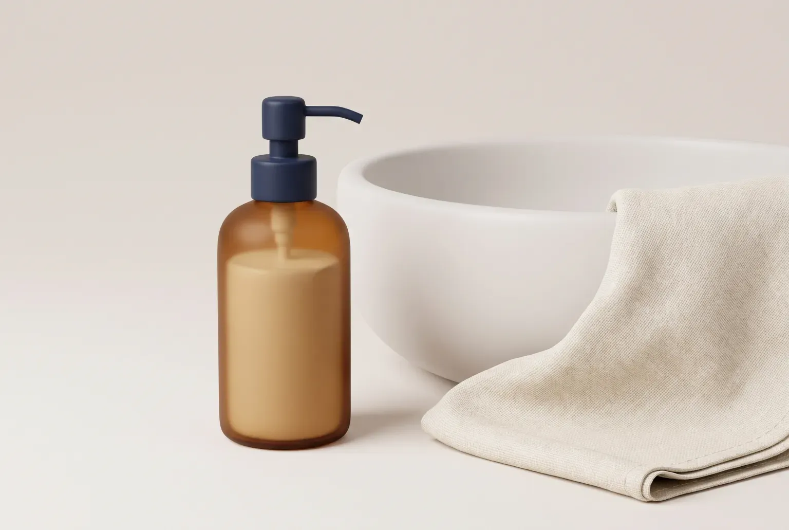 Illustration: an amber glass pump bottle of liquid hand soap with a navy pump beside a white basin and a folded linen towel, drawn as a soft 3D render. Not a real product.