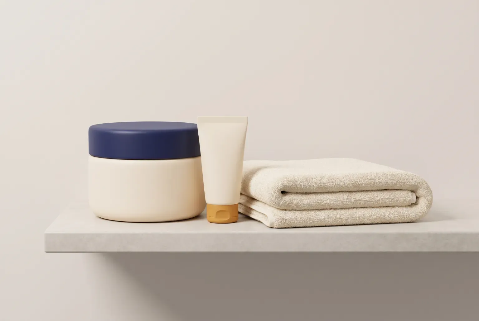 Illustration: a plain cream jar with a navy lid and a small cream tube beside a folded towel on a pale shelf, drawn as a soft 3D render. Not a real product.