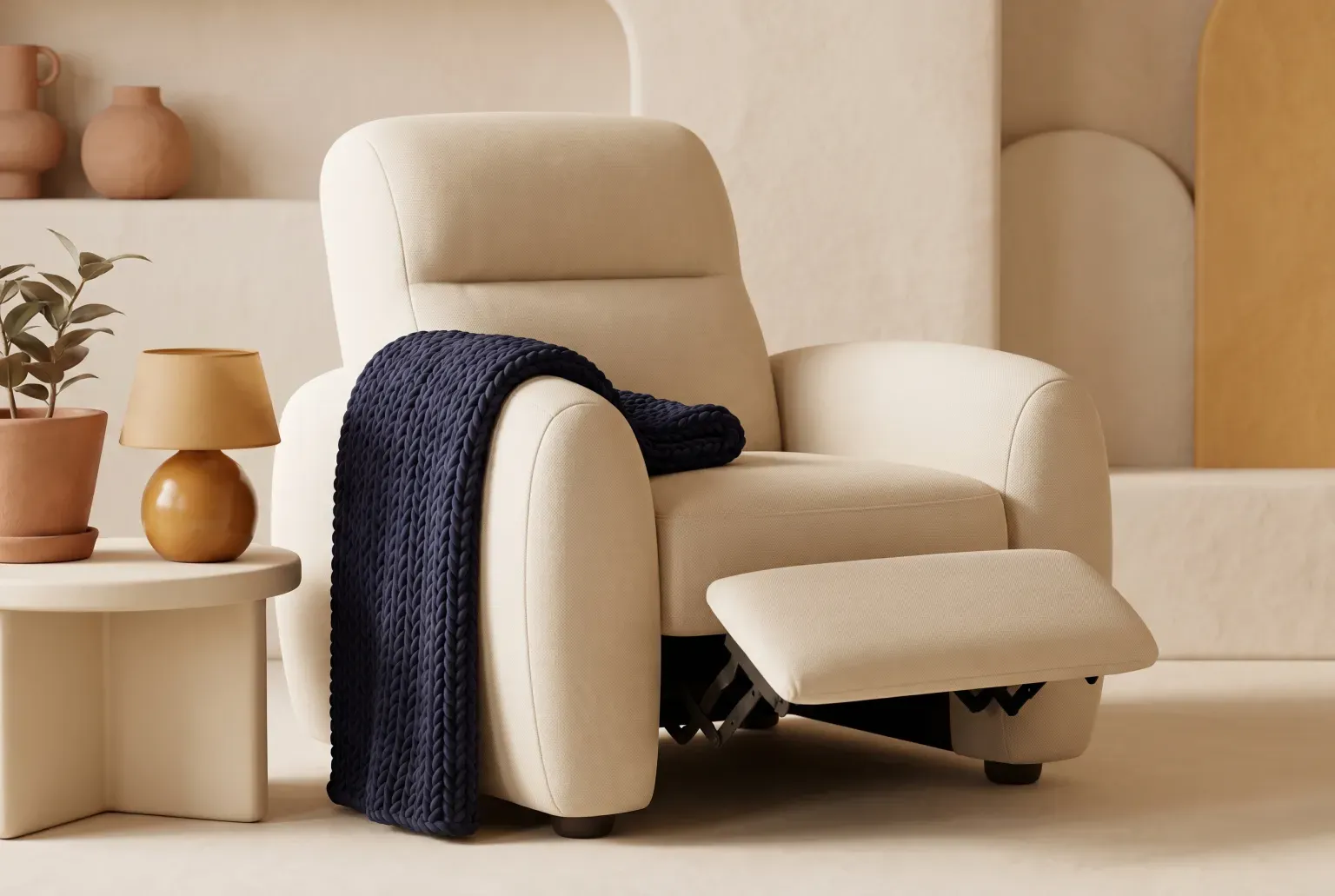 Illustration: a cream fabric reclining armchair with its footrest raised, a navy knitted throw over one arm, in a warm living room corner, drawn as a soft 3D render. Not a real product.